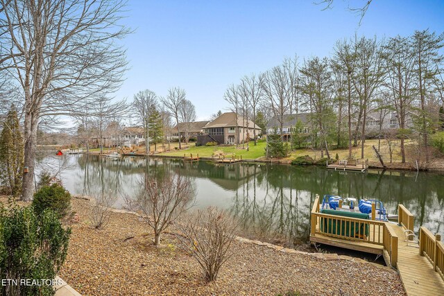 dock area with a water view and a residential view