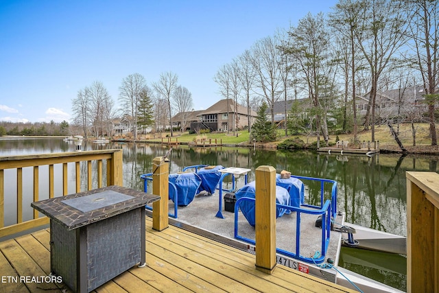 dock area with a water view and a residential view