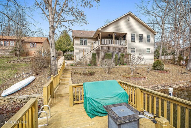 wooden deck with stairway and ceiling fan