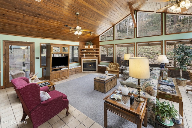 living room featuring light tile patterned floors, wooden ceiling, and a ceiling fan