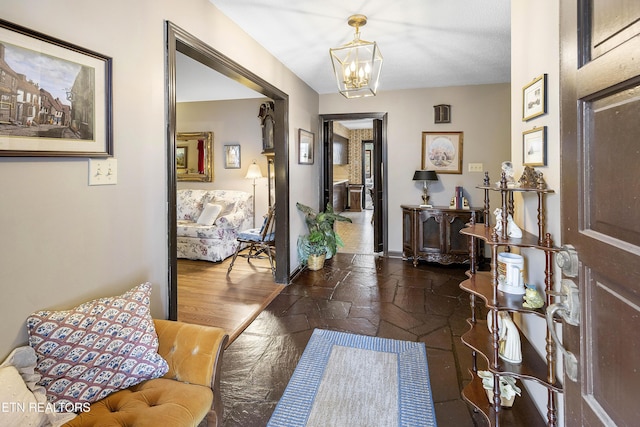 foyer entrance featuring a notable chandelier