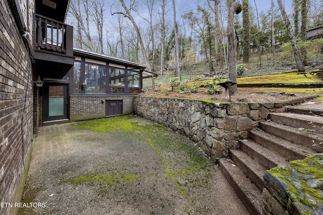 view of yard featuring a sunroom