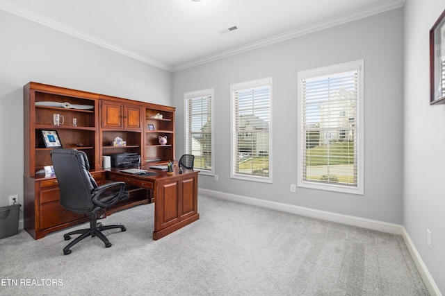 office area with visible vents, light colored carpet, baseboards, and ornamental molding