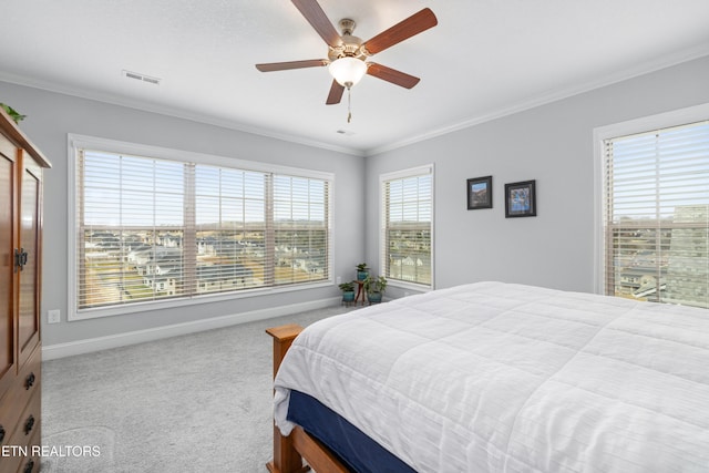 bedroom with crown molding, carpet, visible vents, and baseboards