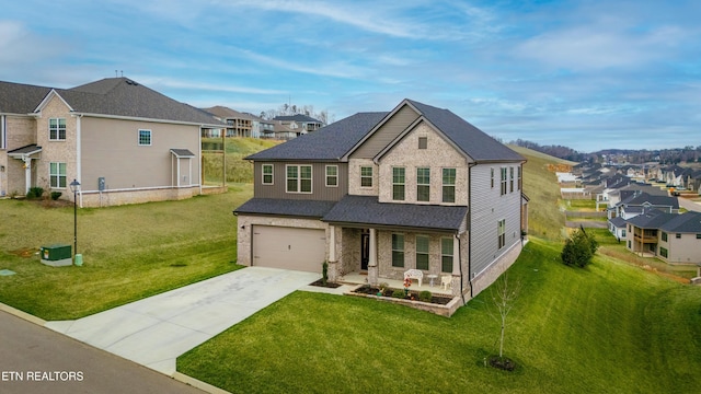 view of front of house featuring a front yard, a porch, an attached garage, concrete driveway, and a residential view