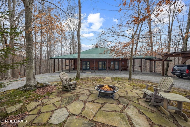 view of patio featuring a fire pit