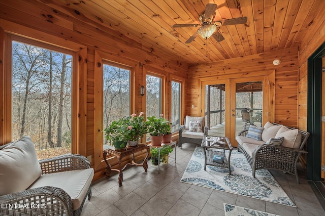 sunroom with wooden ceiling and a ceiling fan