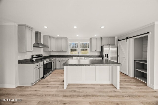 1620 Anna Maria Ln, Cookeville, TN 38501 - kitchen featuring wall chimney exhaust hood, stainless steel appliances, dark countertops, recessed lighting, and a kitchen island