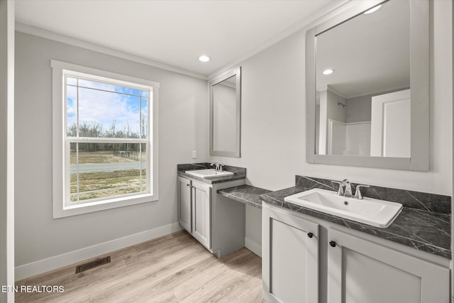 1620 Anna Maria Ln, Cookeville, TN 38501 - full bathroom with wood finished floors, baseboards, two vanities, and recessed lighting