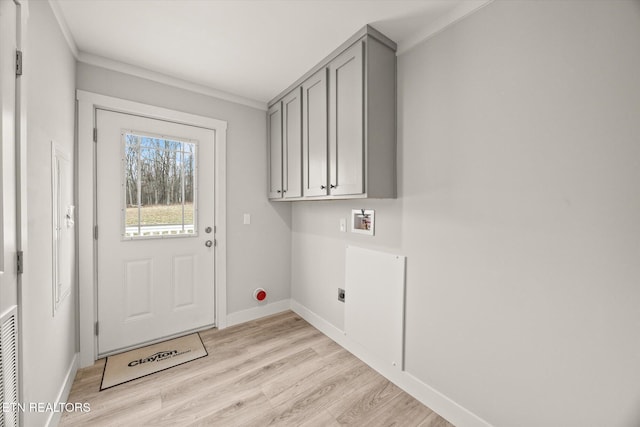 1620 Anna Maria Ln, Cookeville, TN 38501 - laundry area with hookup for a washing machine, ornamental molding, light wood-style floors, electric dryer hookup, and cabinet space