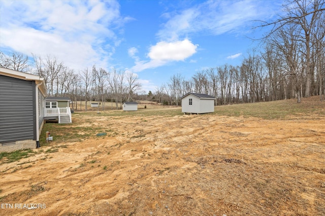 1620 Anna Maria Ln, Cookeville, TN 38501 - view of yard featuring a storage unit and an outdoor structure