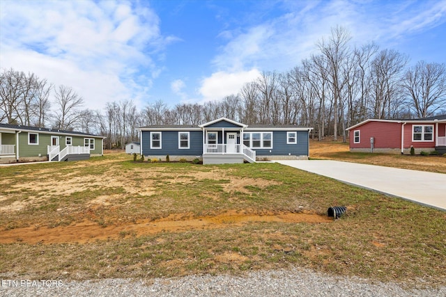 1620 Anna Maria Ln, Cookeville, TN 38501 - view of front of property featuring concrete driveway, a porch, and a front lawn