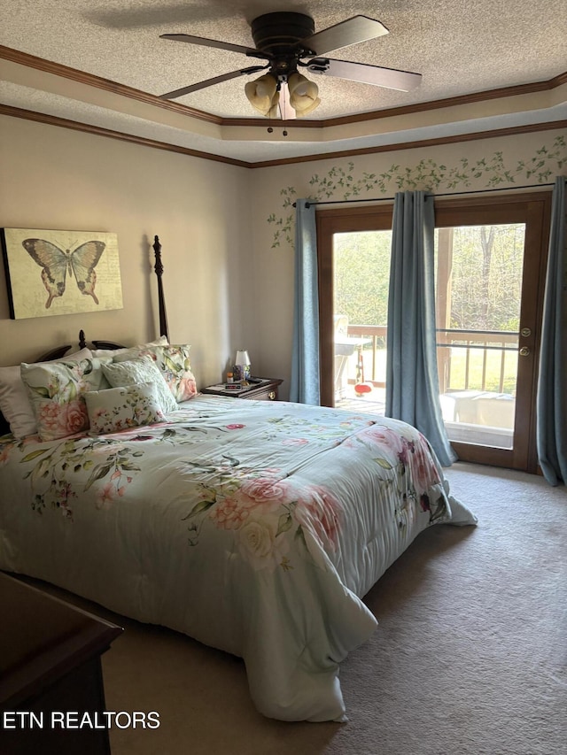 carpeted bedroom featuring crown molding, a ceiling fan, a tray ceiling, and a textured ceiling