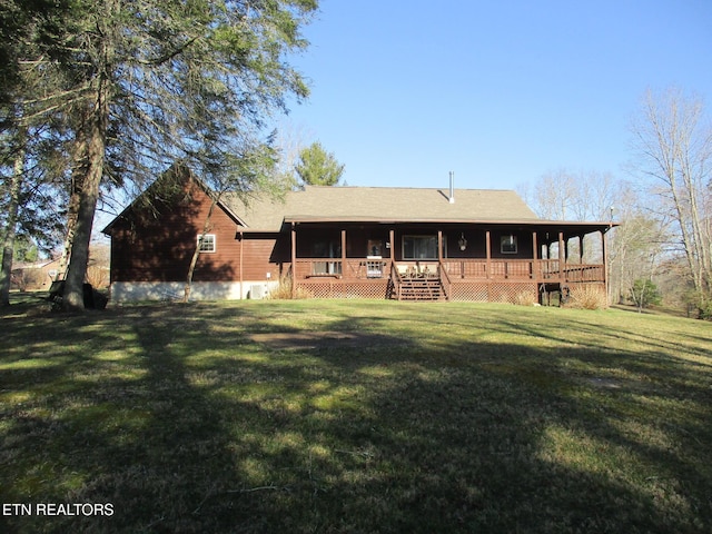 back of house featuring a yard