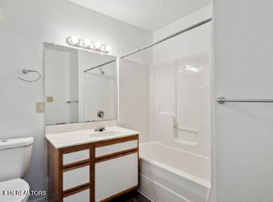 full bathroom with shower / bath combination, toilet, and vanity