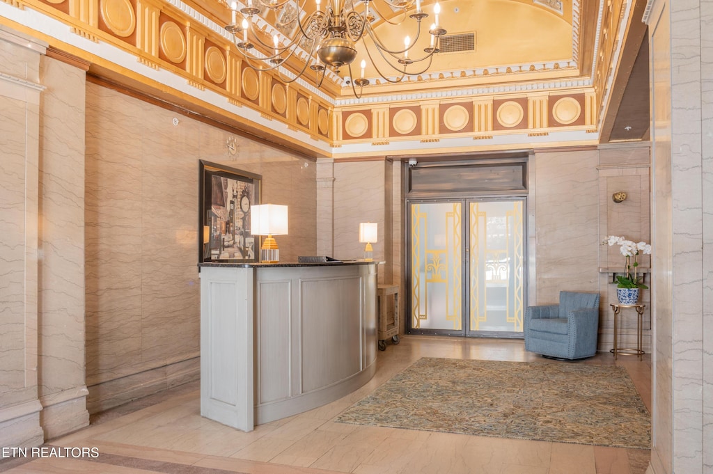 interior space with visible vents and a chandelier