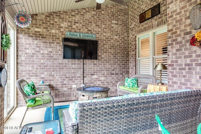 view of patio featuring ceiling fan