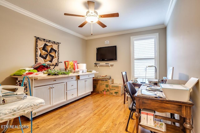 office area featuring ceiling fan, light wood-style floors, and ornamental molding