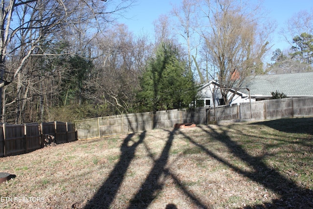 view of yard with a fenced backyard