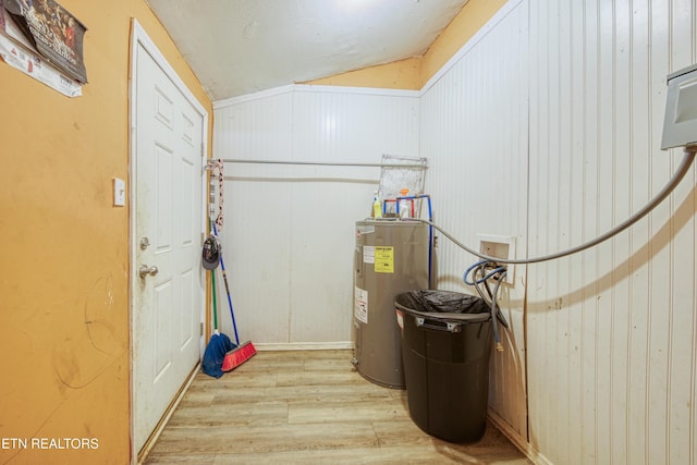 utility room with electric water heater