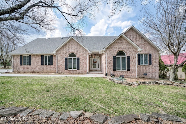 ranch-style house with brick siding, roof with shingles, and a front lawn