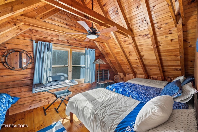 bedroom featuring hardwood / wood-style flooring, lofted ceiling with beams, wood walls, and wooden ceiling