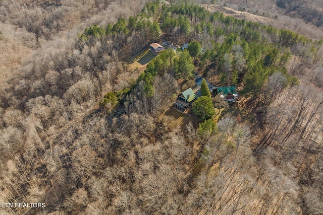 bird's eye view featuring a forest view