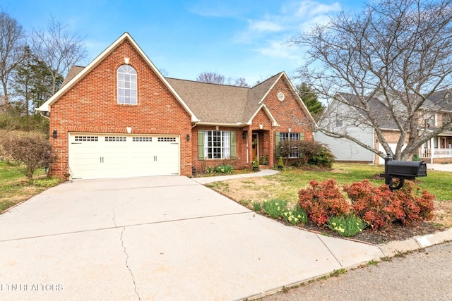 traditional-style house featuring concrete driveway, brick siding, a front yard, and roof with shingles