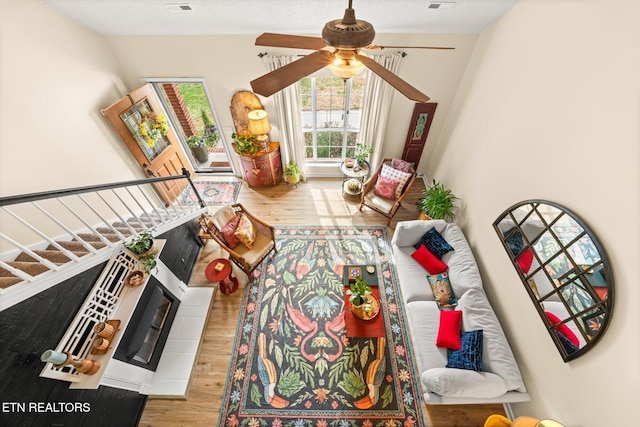 recreation room with visible vents, wood finished floors, and a ceiling fan