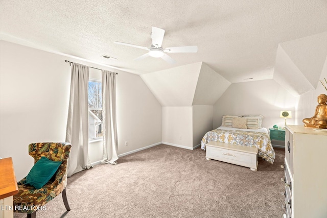 bedroom featuring vaulted ceiling, carpet flooring, a ceiling fan, and a textured ceiling