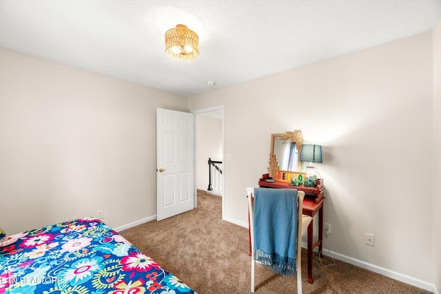 bedroom featuring baseboards and carpet floors