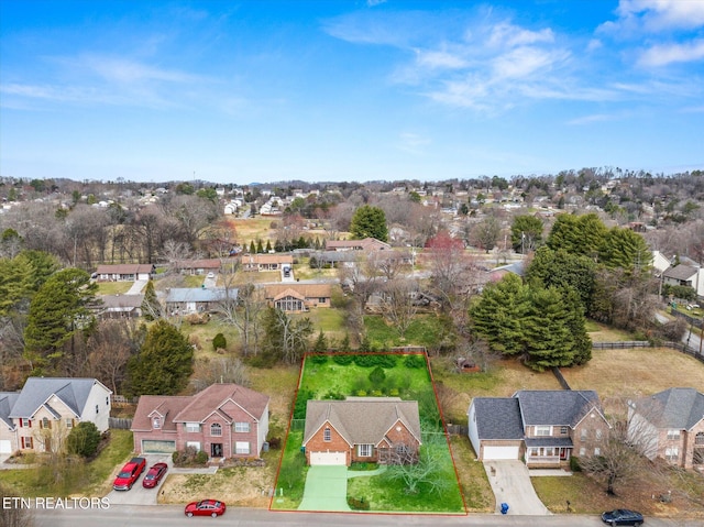 birds eye view of property with a residential view