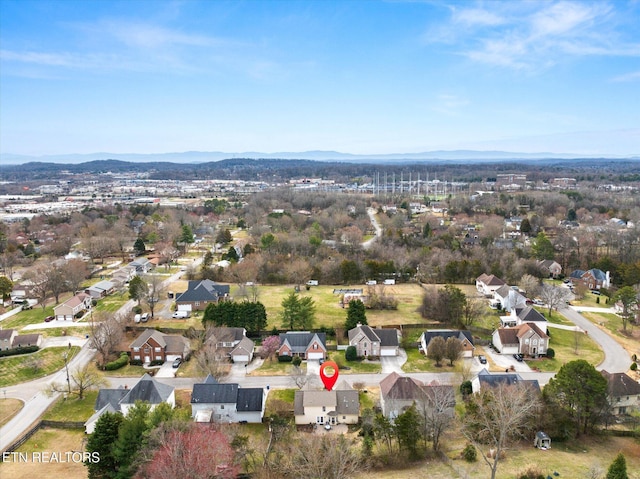 drone / aerial view featuring a mountain view and a residential view