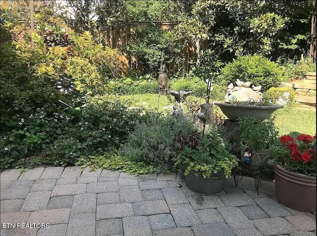 exterior space with a patio and fence