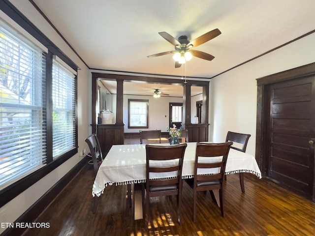 dining space with plenty of natural light, wood finished floors, and ornamental molding