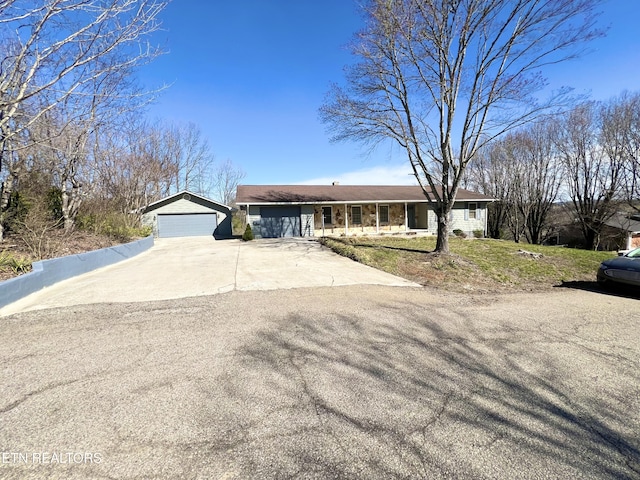 ranch-style home with a garage and a front yard