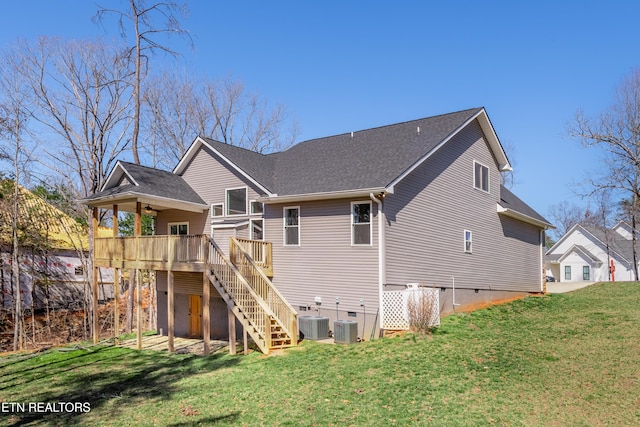 rear view of property with ceiling fan, stairway, a yard, a deck, and crawl space