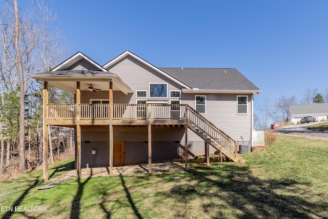 back of house featuring stairway, a wooden deck, a yard, ceiling fan, and central air condition unit