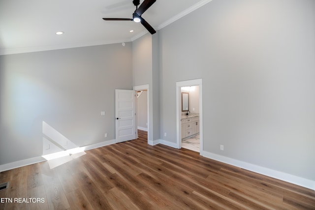 unfurnished bedroom featuring recessed lighting, wood finished floors, baseboards, and ornamental molding