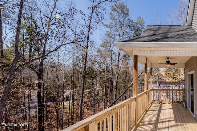 wooden terrace featuring ceiling fan