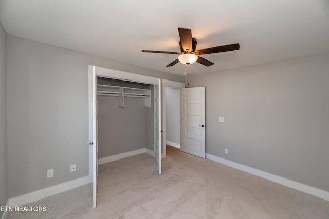 unfurnished bedroom with a closet, a ceiling fan, baseboards, and carpet floors