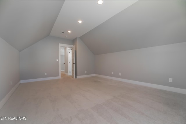 bonus room with recessed lighting, baseboards, light carpet, and vaulted ceiling