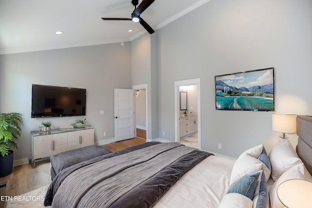 bedroom featuring crown molding, light wood-style flooring, recessed lighting, and baseboards