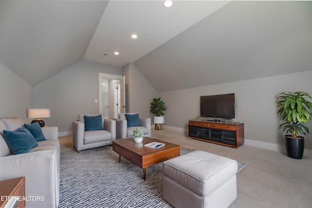 living room with carpet flooring, baseboards, and vaulted ceiling