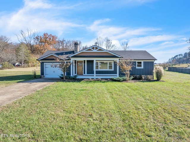 view of front of home featuring a garage, a front yard, board and batten siding, and driveway