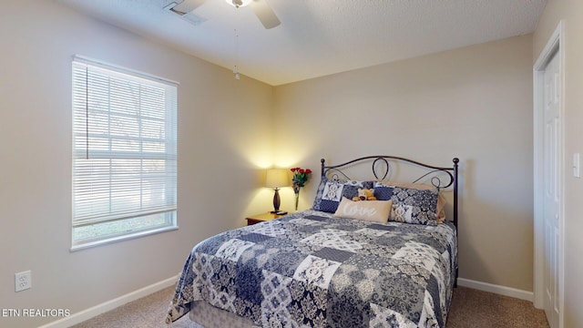 bedroom with visible vents, baseboards, and carpet