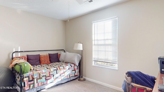 carpeted bedroom with visible vents and baseboards