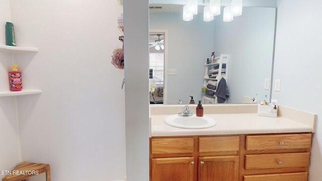 bathroom featuring visible vents, a ceiling fan, and vanity