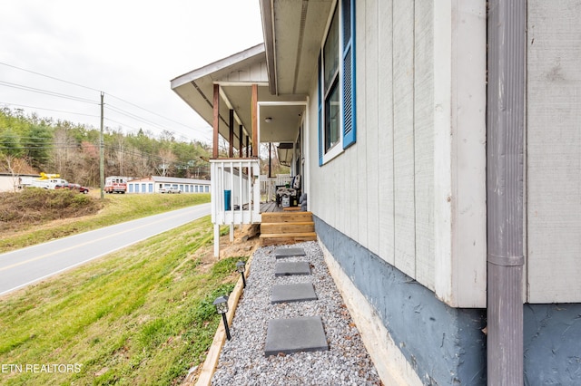 exterior space featuring a lawn and a porch