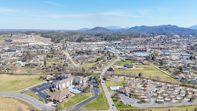 birds eye view of property featuring a mountain view